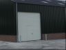 Industriedeur met loopdeur zonder drempel.